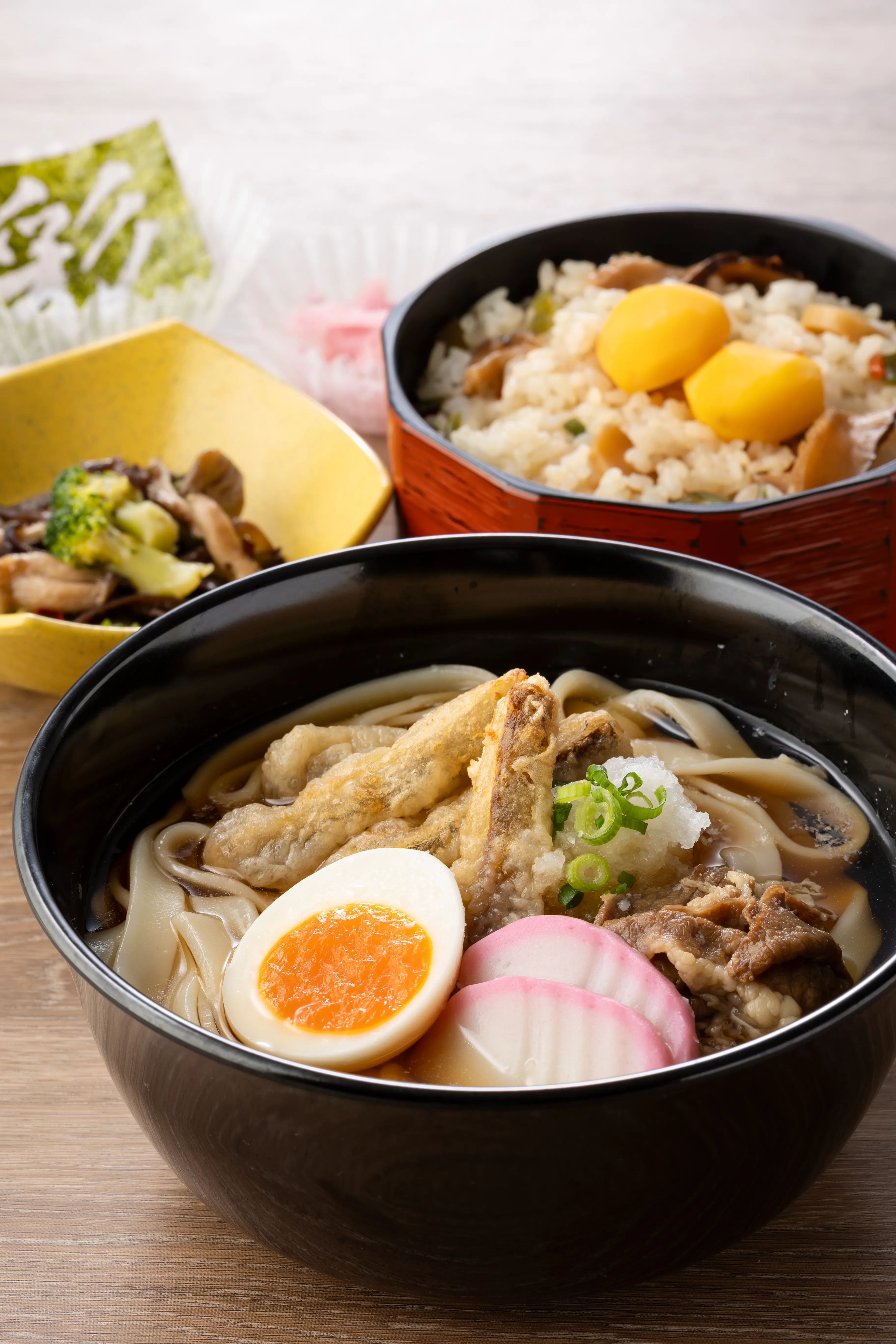Kishimen Noodles Topped With Beef Sukiyaki And Egg And Seasonal Rice Dish